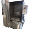 MAGIDO FLS Series front load aqueous parts washer with open door, rotating turntable, and control panel