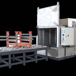 Magido Titanium Series pipe washer with roller feed table and rack of pipes at the wash chamber entrance